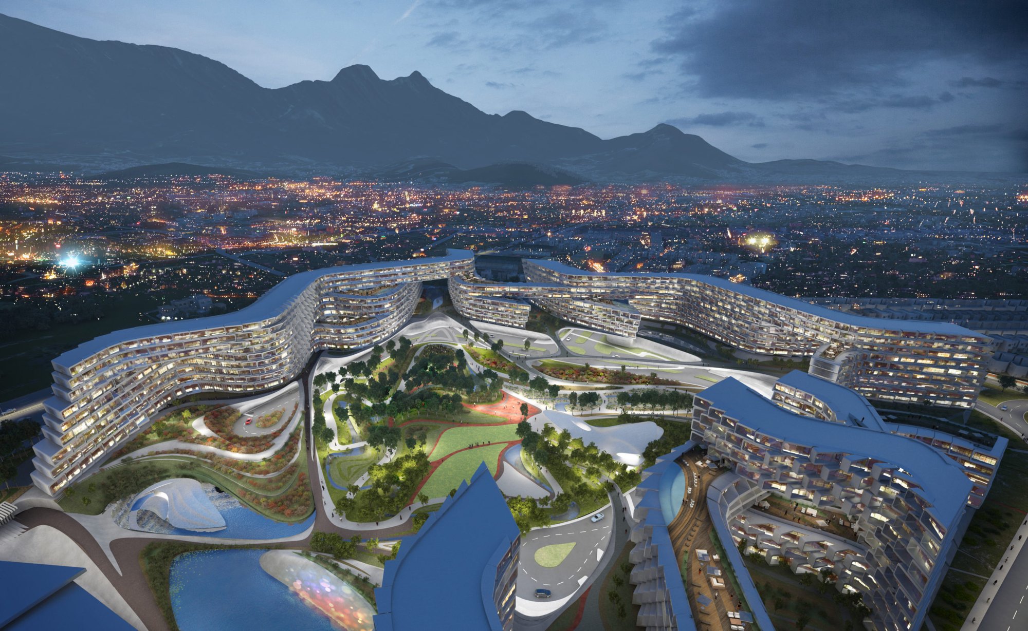Vista aérea de Esfera Monterrey de noche, el anillo residencial iluminado alrededor de su parque central al pie de la Sierra Madre